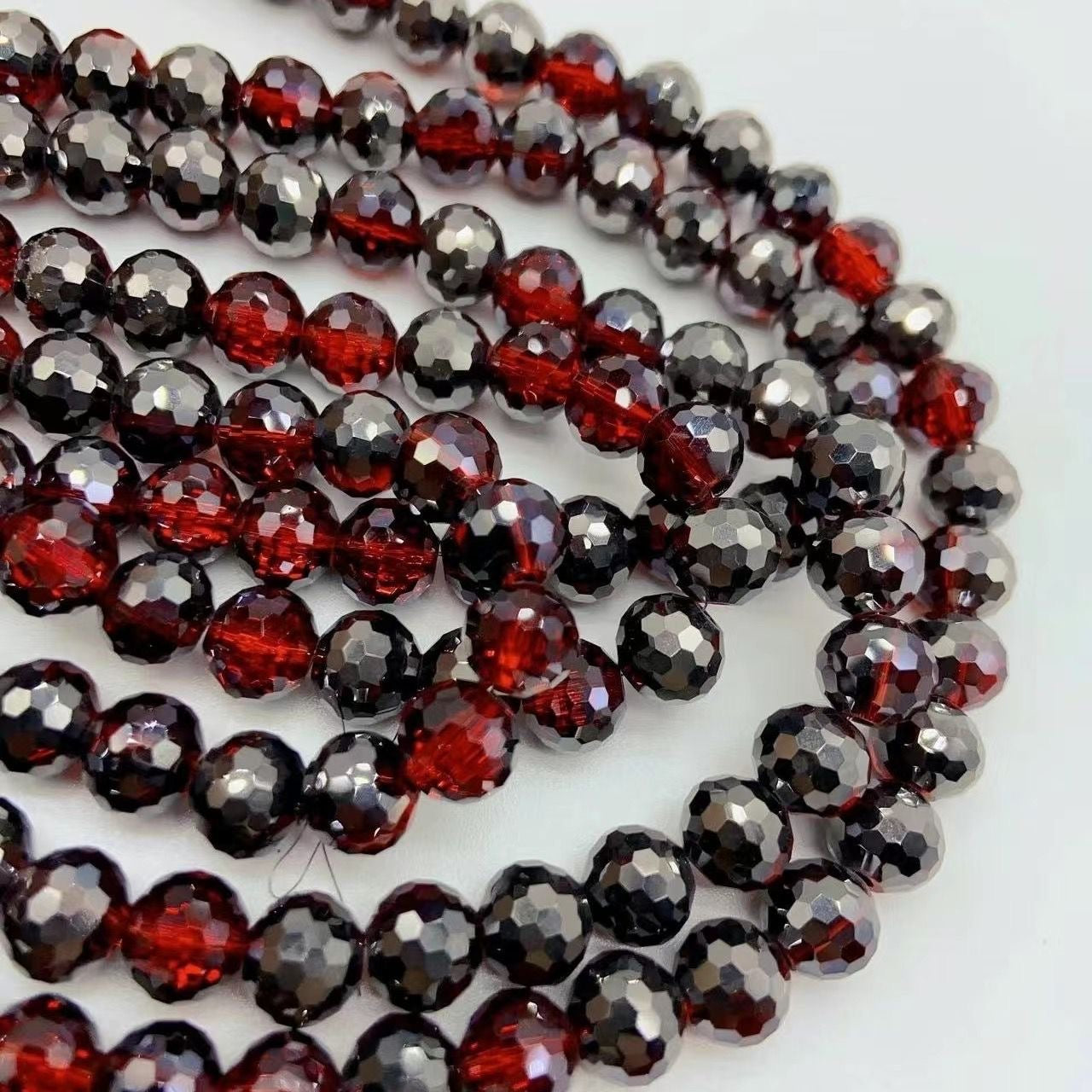 Glass faceted strands (approx 70pcs)